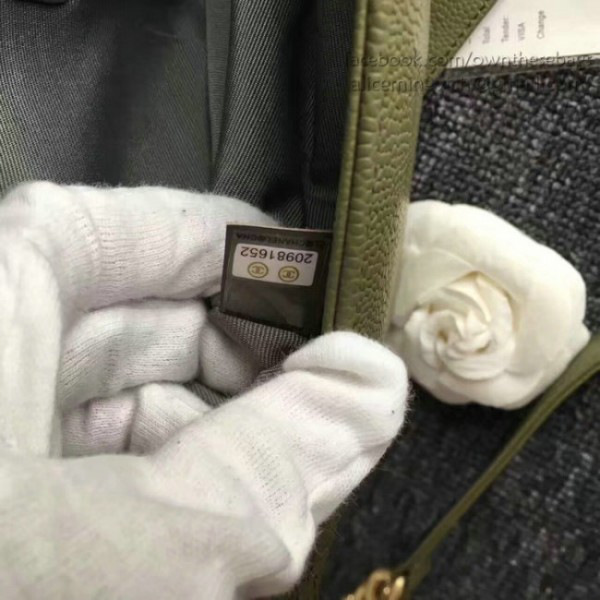 Ch**el quilted caviar boy bag with top handle green