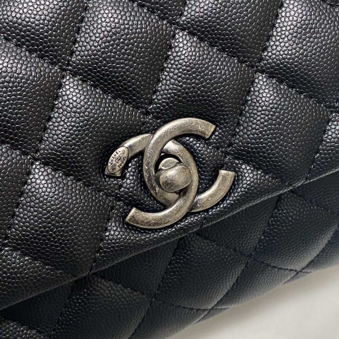 Ch**el flap bag with black top handle grained calfskin silver metal black a92990 23 cm